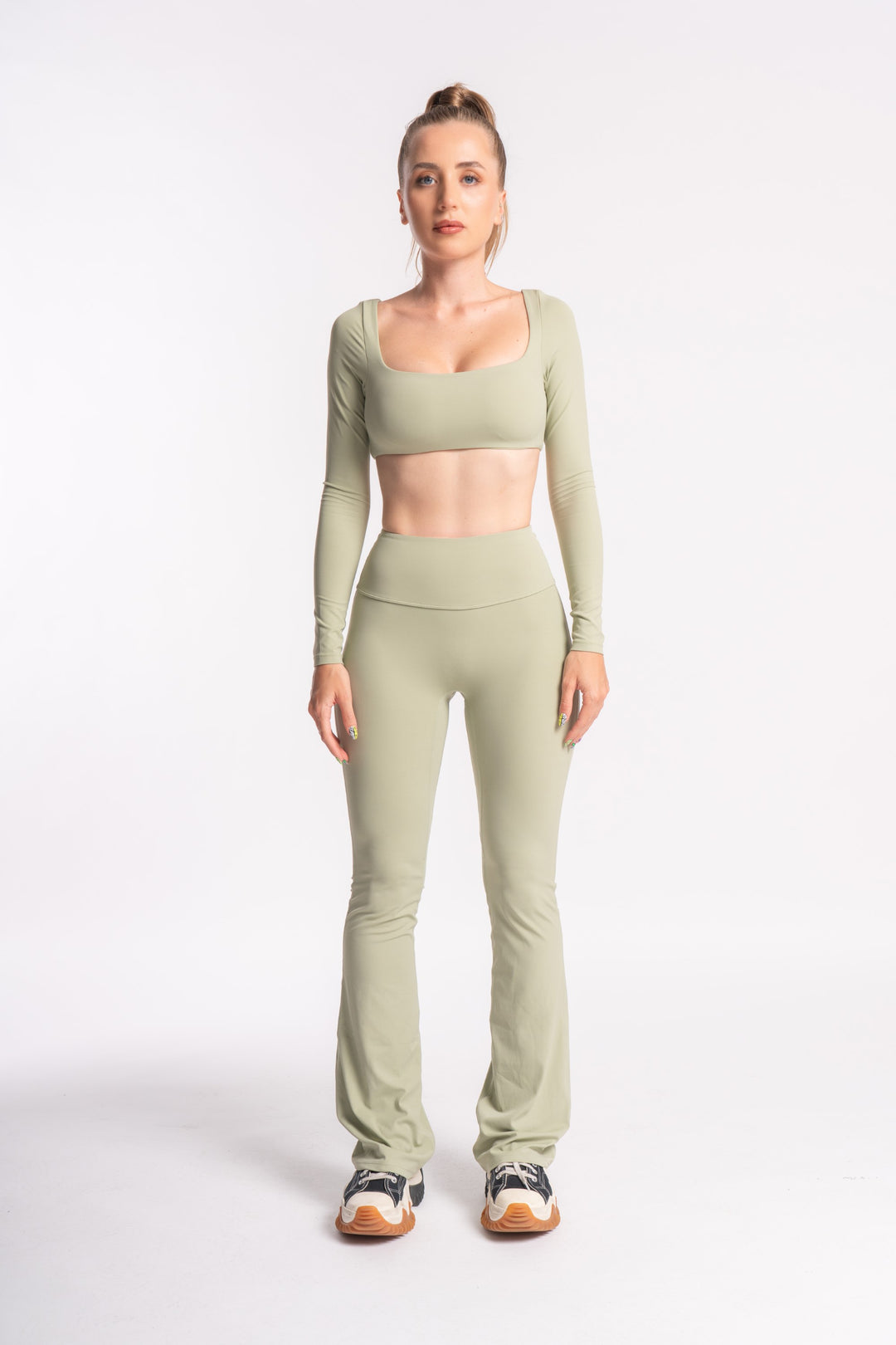 Women's activewear set with full-sleeve crop top and high-waist leggings